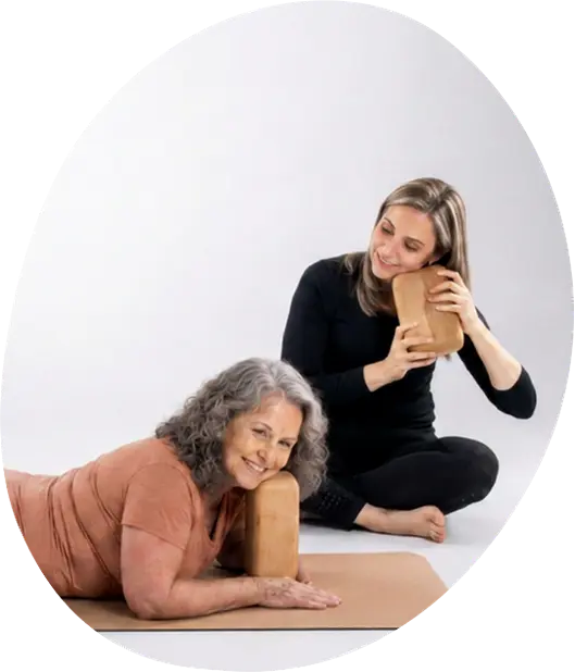 Helen Ronnenbergh guiding a client through a face and neck fascia release session using a cedar block