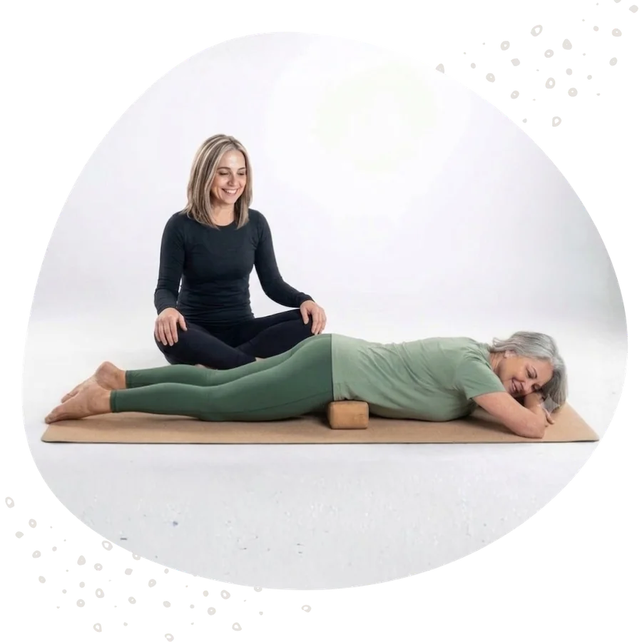 Helen Ronnenbergh guiding a client through a SloFlow hip myofascial release session using a cedar block